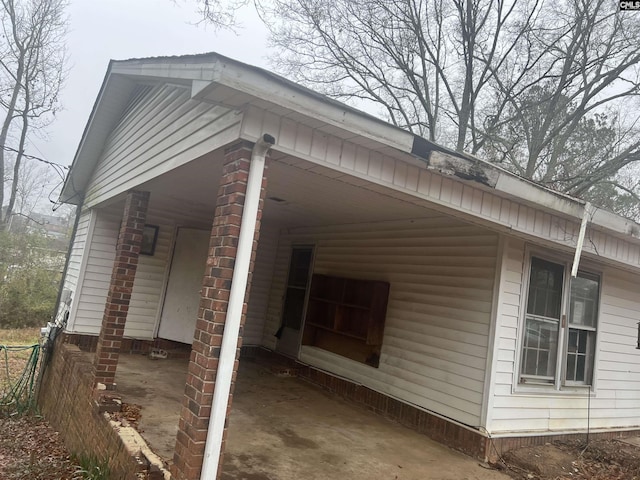 view of home's exterior with a carport