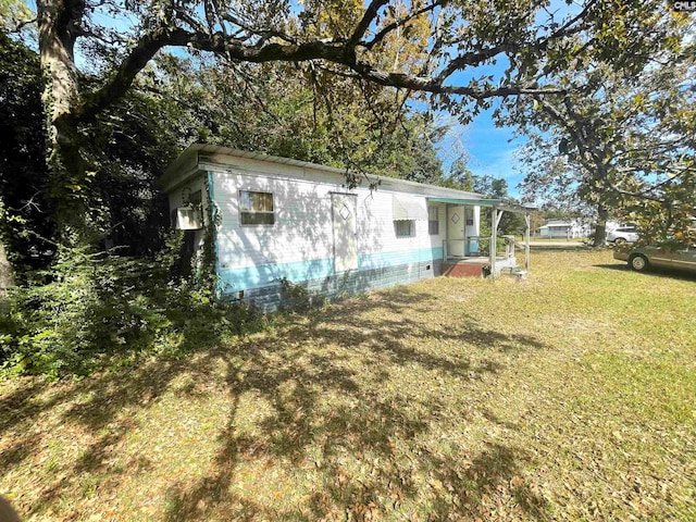 view of property exterior with a yard