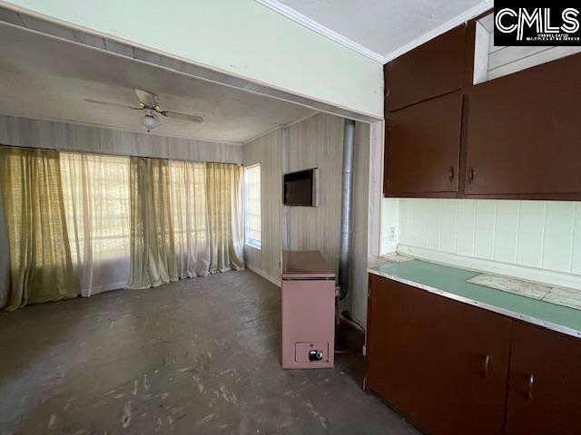 kitchen with concrete floors and ceiling fan