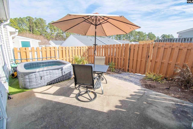 view of patio with a hot tub