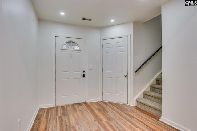 entryway with light hardwood / wood-style floors