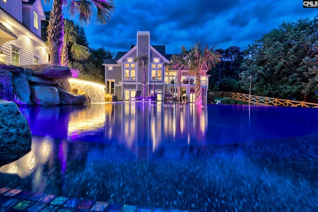 view of swimming pool with a water view