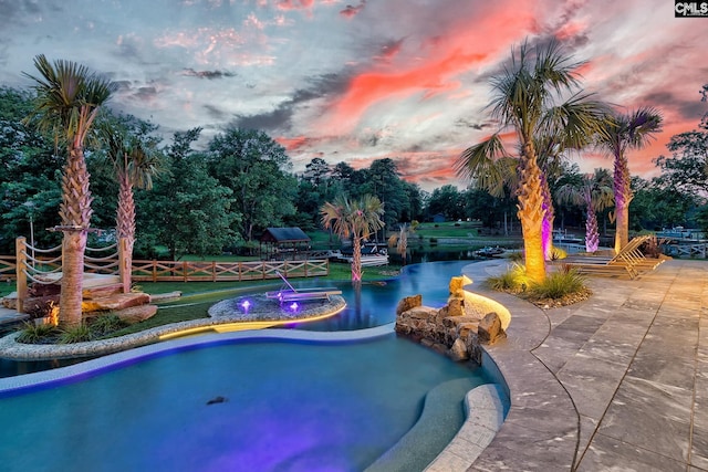 outdoor pool with a water view