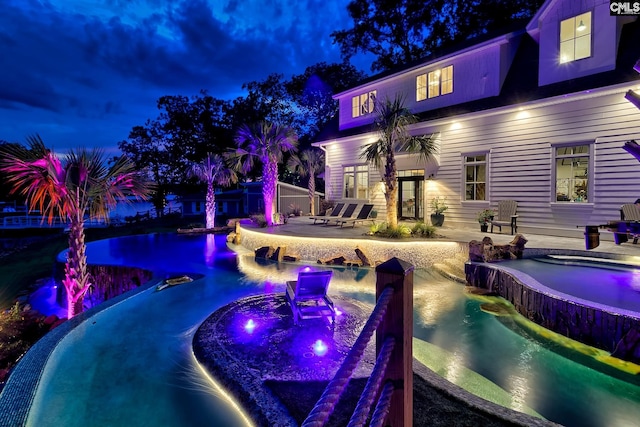 view of pool featuring an infinity pool and a patio area