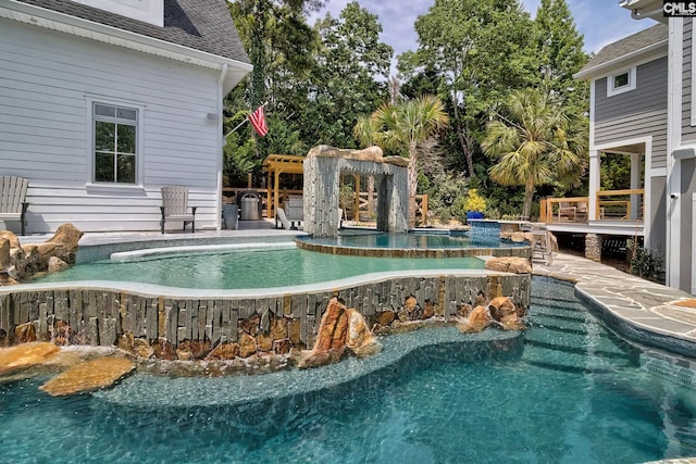 outdoor pool featuring a jacuzzi