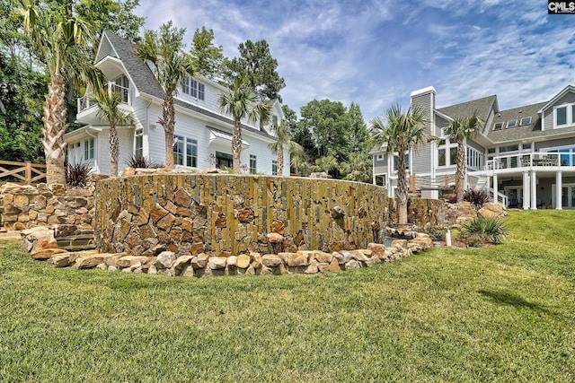 view of yard featuring a garage and a residential view