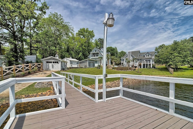 exterior space featuring a residential view, a deck, and a yard