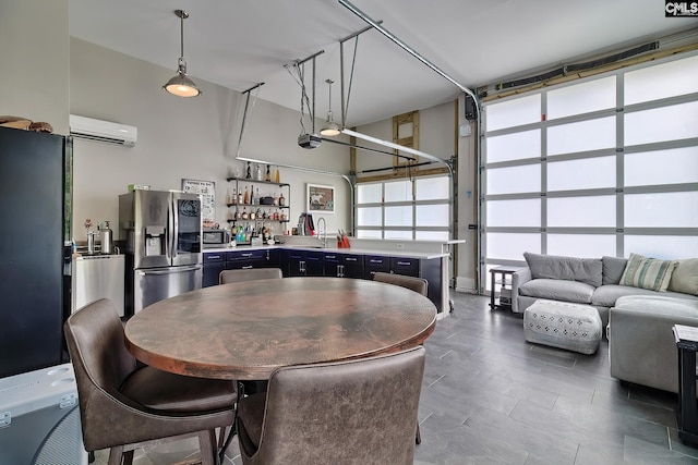 dining area with indoor wet bar and a wall mounted AC