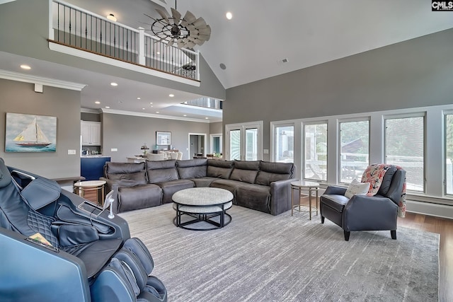 living area featuring crown molding, recessed lighting, visible vents, a high ceiling, and light wood-style floors