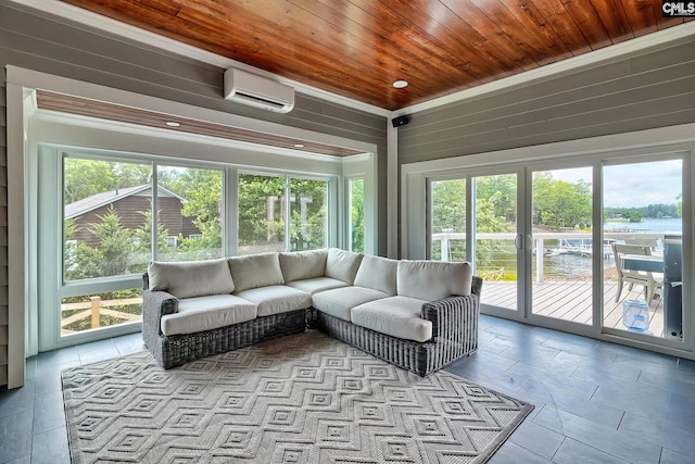 sunroom with a wall unit AC, a water view, and wood ceiling