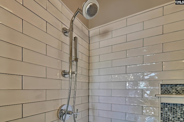 bathroom with a tile shower