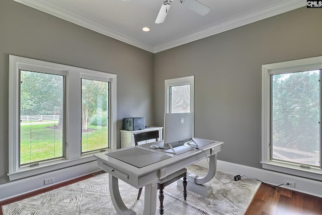 home office featuring baseboards, ornamental molding, a ceiling fan, and light wood-style floors