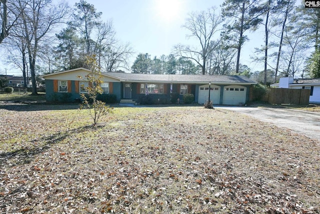 ranch-style home with a garage