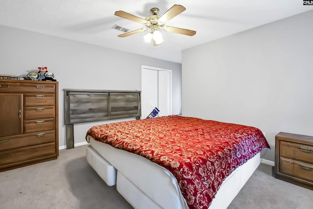 carpeted bedroom featuring a closet and ceiling fan