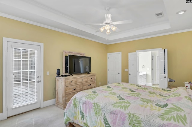 carpeted bedroom featuring access to exterior, ceiling fan, ensuite bath, a raised ceiling, and crown molding