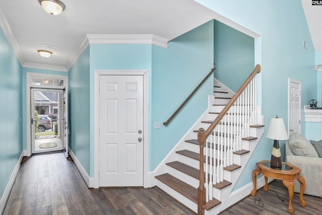 staircase with hardwood / wood-style flooring and ornamental molding