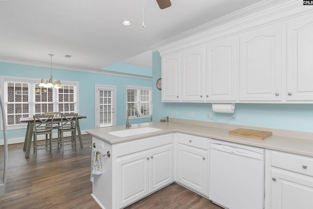 kitchen featuring white cabinetry, sink, kitchen peninsula, white dishwasher, and decorative light fixtures