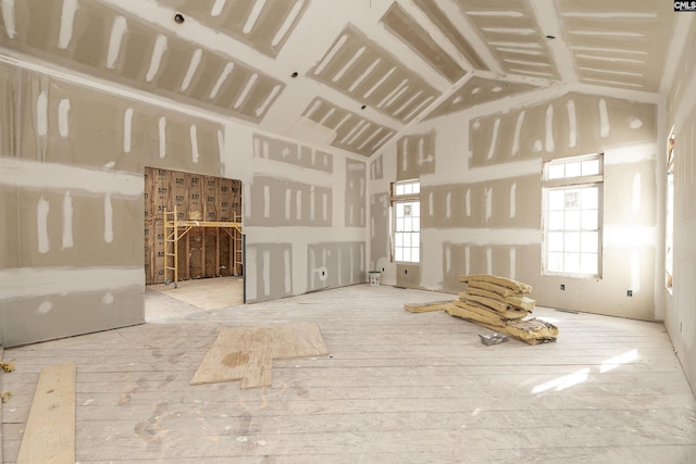 empty room featuring high vaulted ceiling