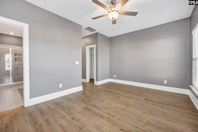 spare room with light hardwood / wood-style floors and ceiling fan