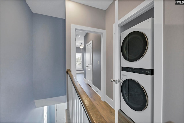 laundry area featuring stacked washer and dryer