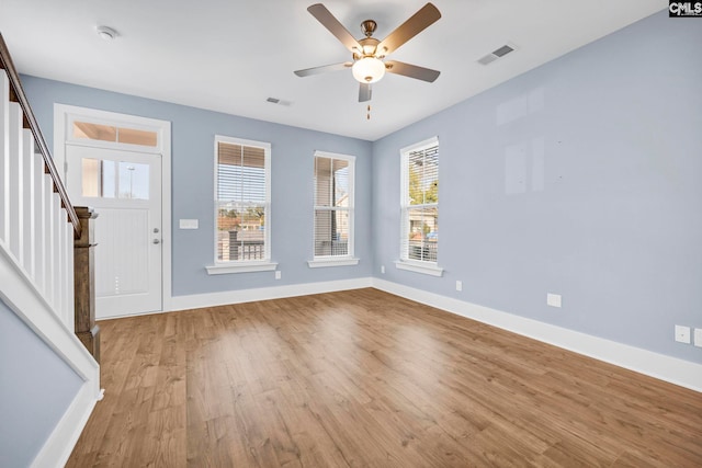 entrance foyer with ceiling fan, plenty of natural light, and light wood-type flooring