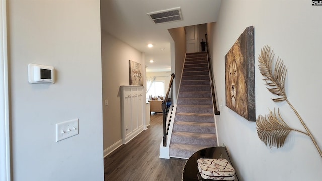 stairway with wood-type flooring