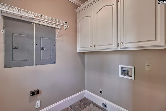 laundry area with cabinets, electric dryer hookup, dark tile patterned floors, electric panel, and hookup for a washing machine