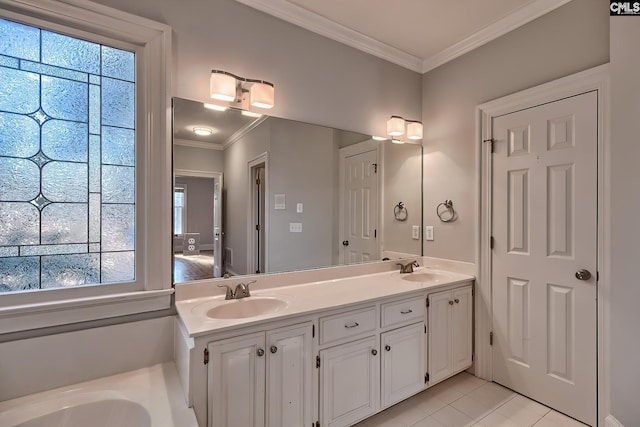 bathroom with tile patterned floors, a wealth of natural light, crown molding, and vanity