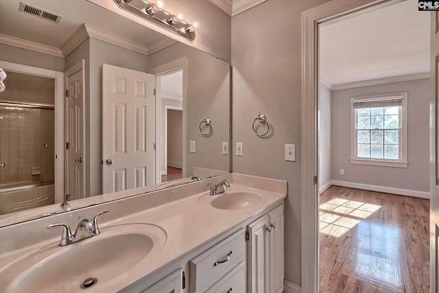 bathroom with plus walk in shower, vanity, hardwood / wood-style flooring, and crown molding