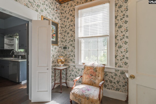 sitting room featuring tile patterned flooring and sink