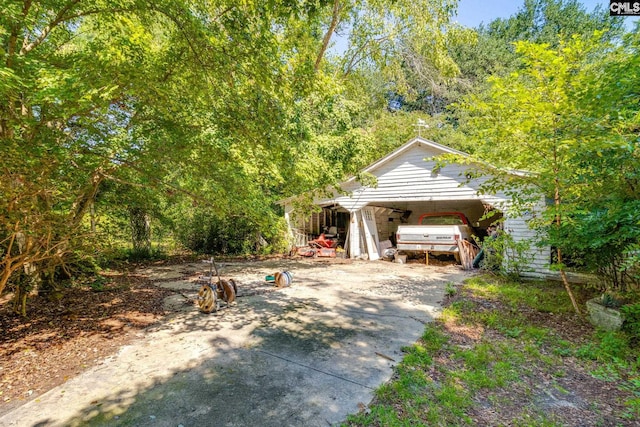 exterior space featuring an outbuilding and a garage