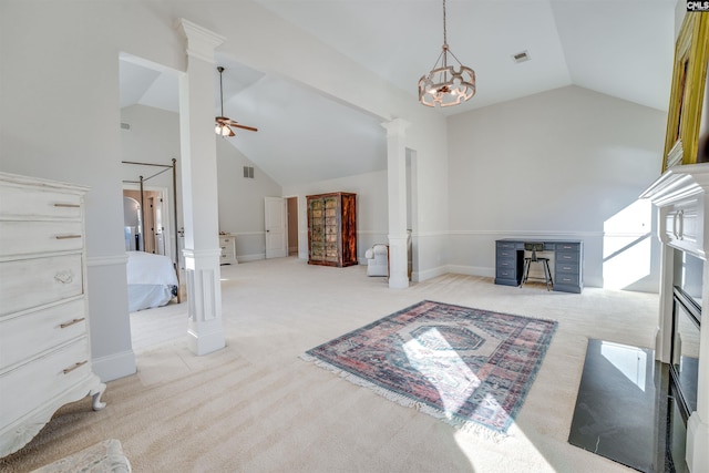 interior space with ceiling fan with notable chandelier, high vaulted ceiling, and decorative columns