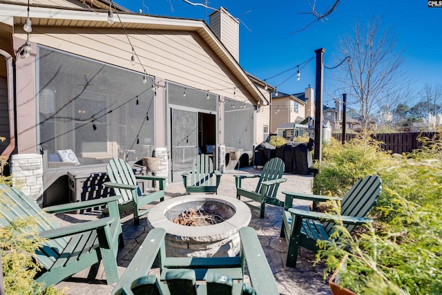 view of patio with an outdoor fire pit