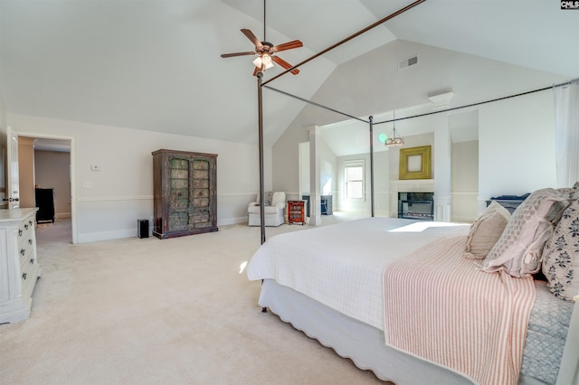 carpeted bedroom with vaulted ceiling and ceiling fan