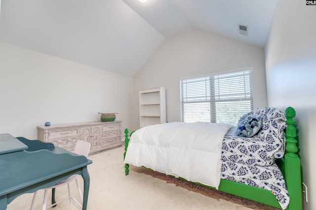 carpeted bedroom with vaulted ceiling