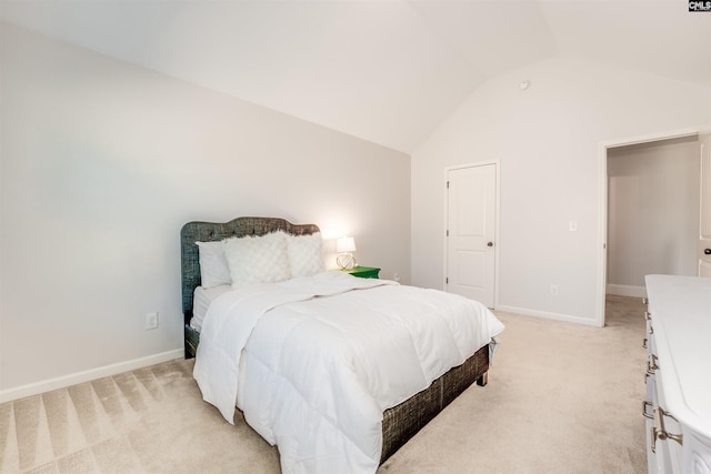 carpeted bedroom with vaulted ceiling