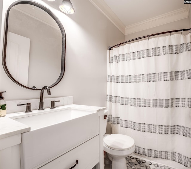 bathroom with vanity, toilet, and ornamental molding