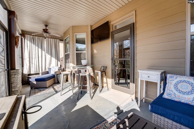 exterior space featuring a porch and ceiling fan