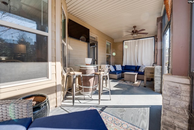 sunroom / solarium with ceiling fan