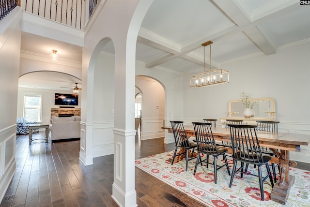 dining area featuring beamed ceiling, dark hardwood / wood-style floors, and coffered ceiling