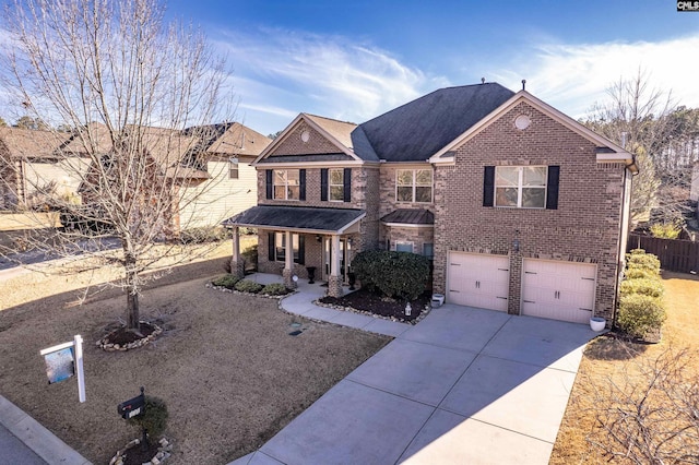 view of front of property featuring covered porch and a garage