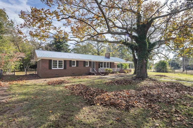 ranch-style house featuring a front yard