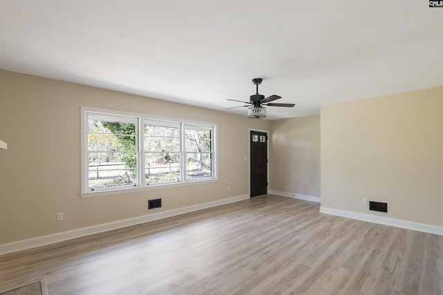 interior space with ceiling fan and light hardwood / wood-style floors