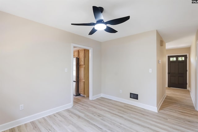 unfurnished room featuring ceiling fan and light hardwood / wood-style floors