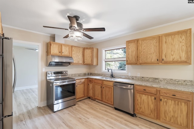 kitchen featuring ceiling fan, sink, light wood-type flooring, appliances with stainless steel finishes, and ornamental molding