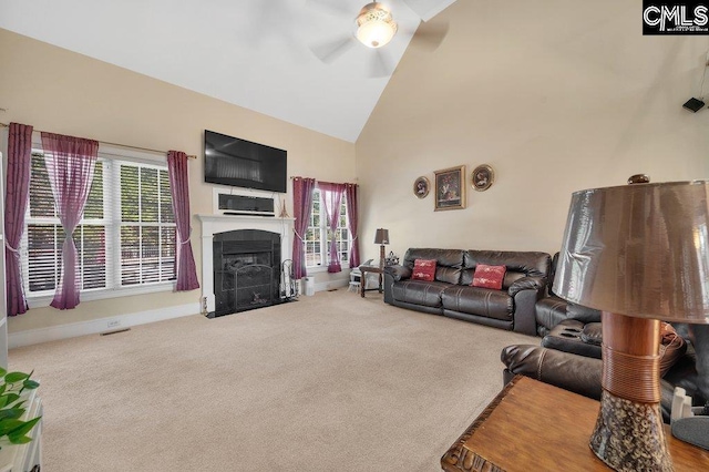 living room with carpet flooring, high vaulted ceiling, and ceiling fan