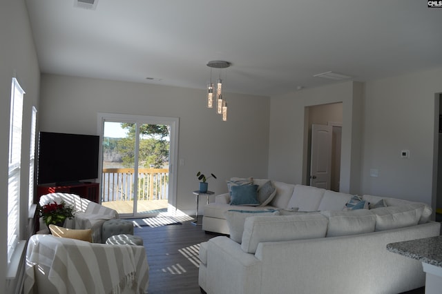 living room with dark hardwood / wood-style floors