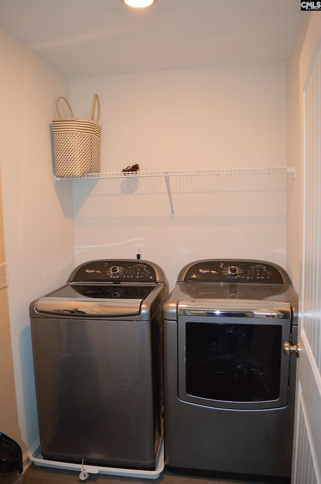 laundry area with separate washer and dryer