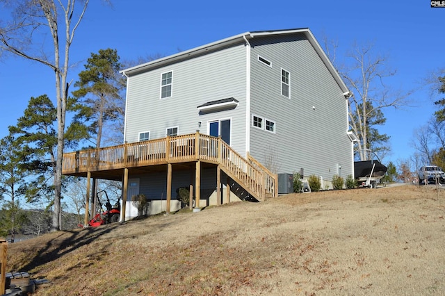 back of property with a wooden deck