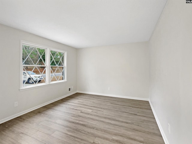 unfurnished room featuring light wood-type flooring